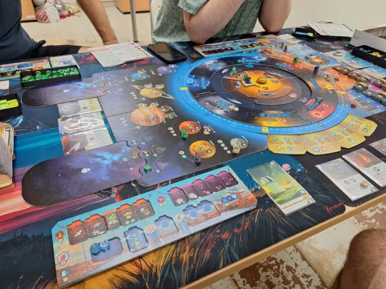 Club members playing SETI: Search for Extraterrestrial Intelligence at Warsaw Board Game Club — circular game board with planets, satellites, and resources